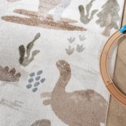 Waschbarer Kinderteppich - Mace Dino Creme